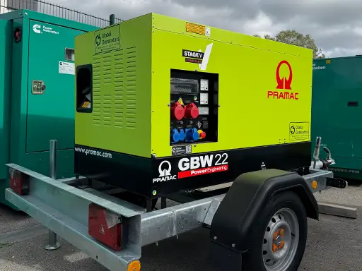 A trailer-mounted Pramac GBW22P 20kVA Perkins Stage V silent canopied diesel generator loaded on a lorry ready for delivery to a tool and construction equipment hire company in Derbyshire, UK