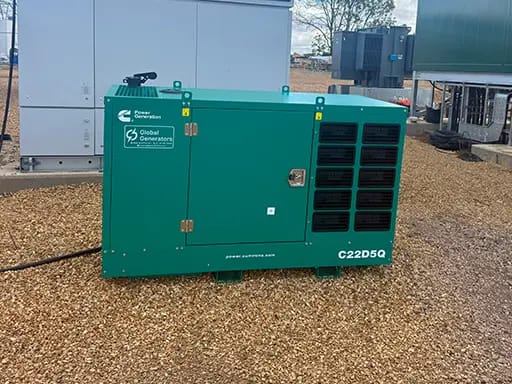 A Cummins C22D5Q 22kVA 3 phase silent canopied diesel generator on-site at a new solar & BESS facility under construction in Hertfordshire, UK to power the site's critical telecoms infrastructure